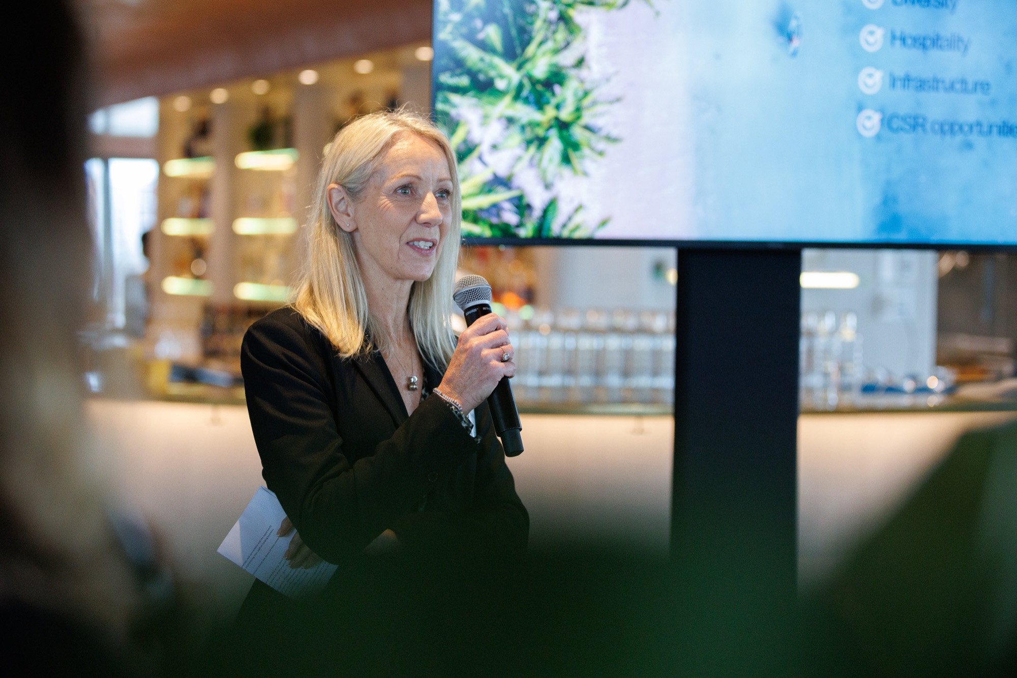 Speaker addressing the AUNZ MICE Club community