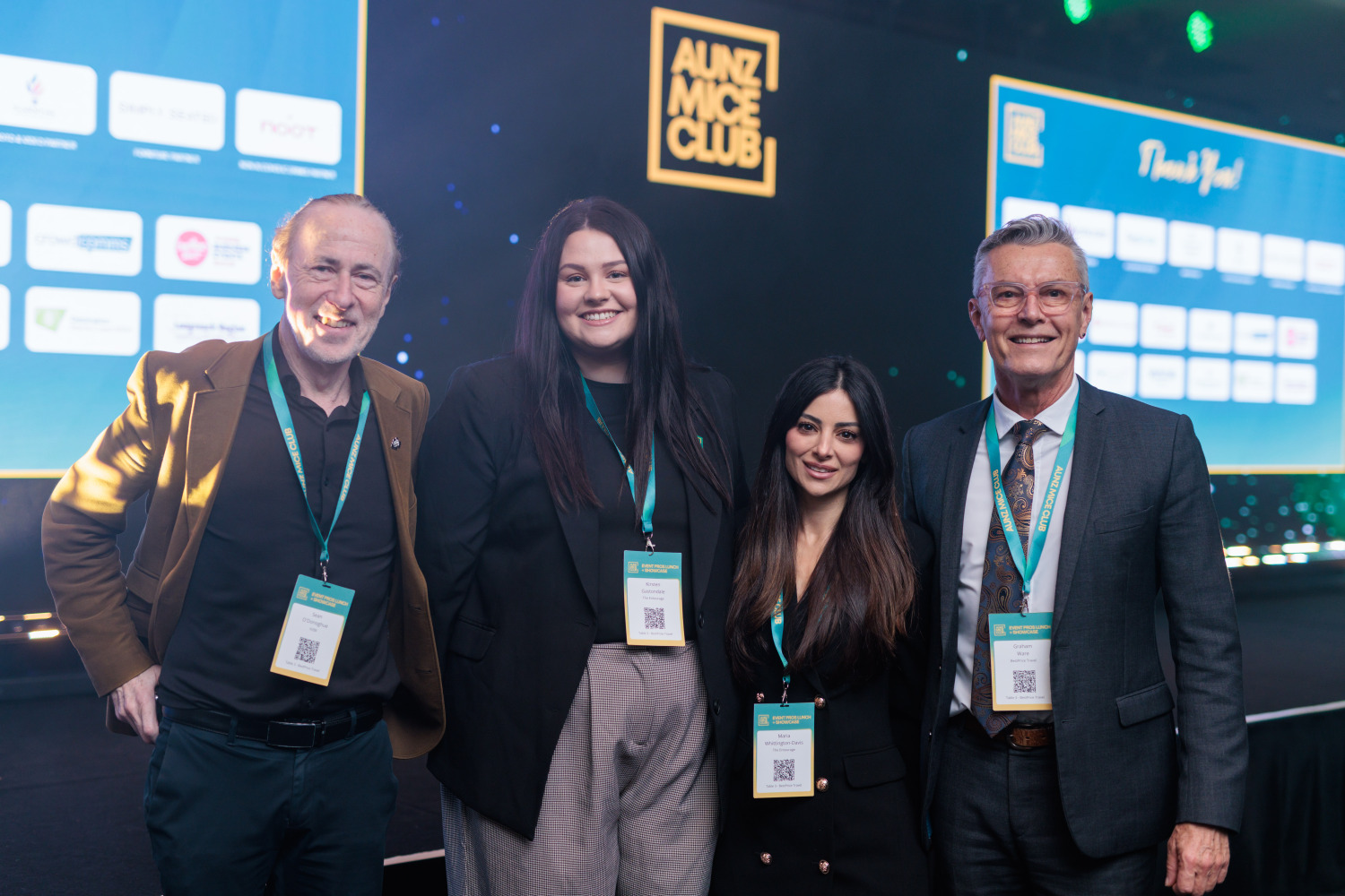 AUNZ MICE Club guests together in front of the Sydney event stage